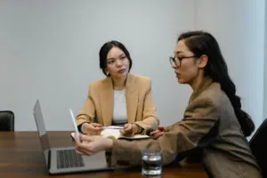 Image of two women in a meeting for the california probate fees Blog Article