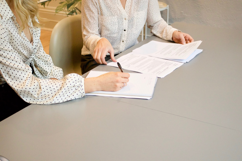 Image of two people working on a contract for the probate lawyer california Blog Article